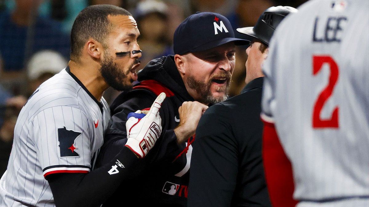 Minnesota Twins shortstop Carlos Correa (4, left) and manager Rocco Baldelli (5, middle) argue with umpire Austin Jones (right) during the seventh inning against the Seattle Mariners at T-Mobile Park. Correa and Baldelli were both ejected from the game.