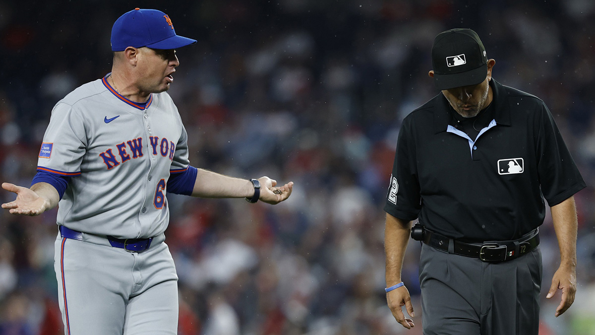 New York Mets manager Carlos Mendoza (64) argues with first base umpire Alfonso Marquez (72) against the Washington Nationals during the fourth inning.