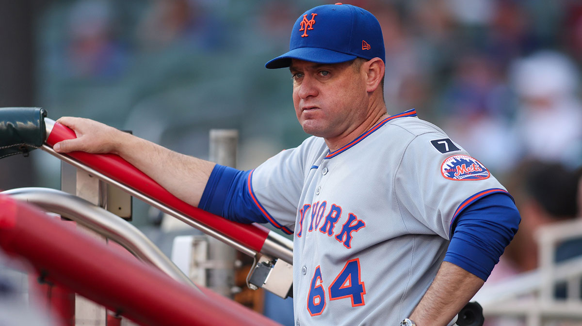New York Mets manager Carlos Mendoza (64) in the dugout before a game against the Atlanta Braves.