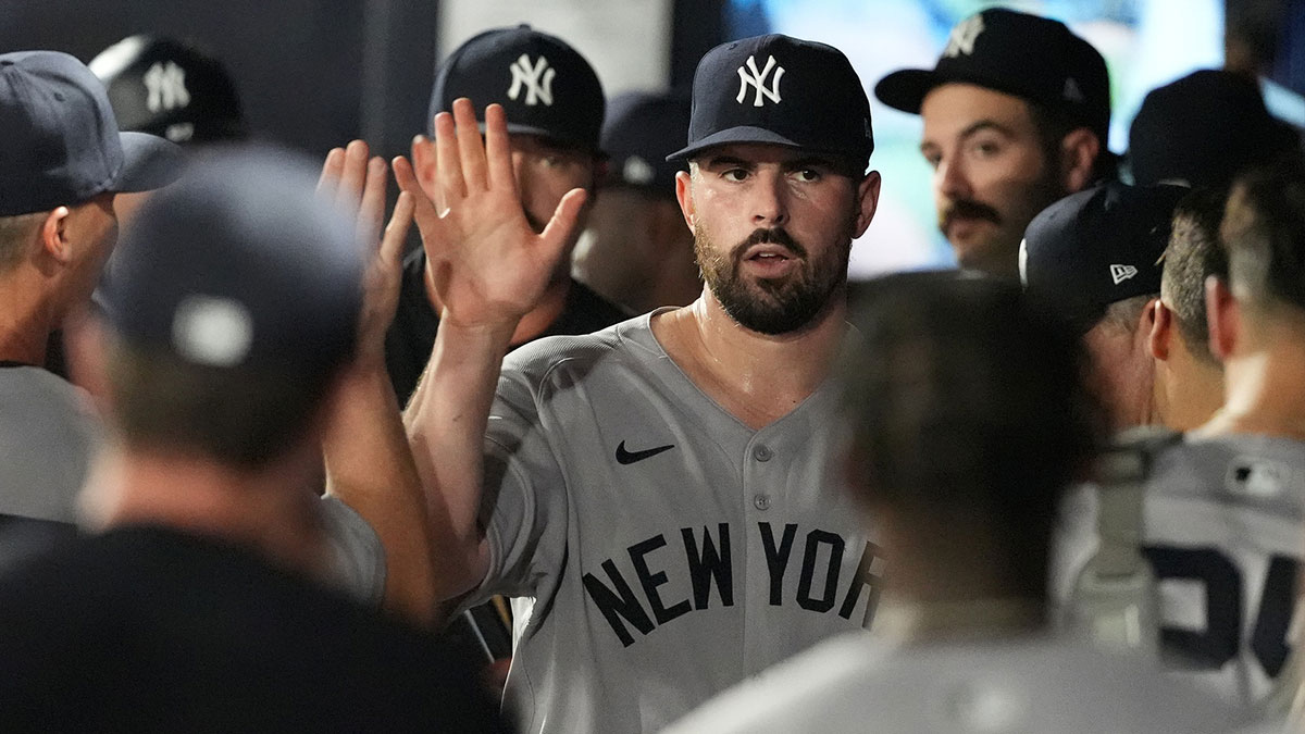 Apr 18, 2025; Tampa, Florida, USA; New York Yankees starting pitcher Carlos Rodon (55) is congratulated in the dugout after getting out of the sixth inning against the Tampa Bay Rays at George M. Steinbrenner Field. Mandatory Credit: Dave Nelson-Imagn Images