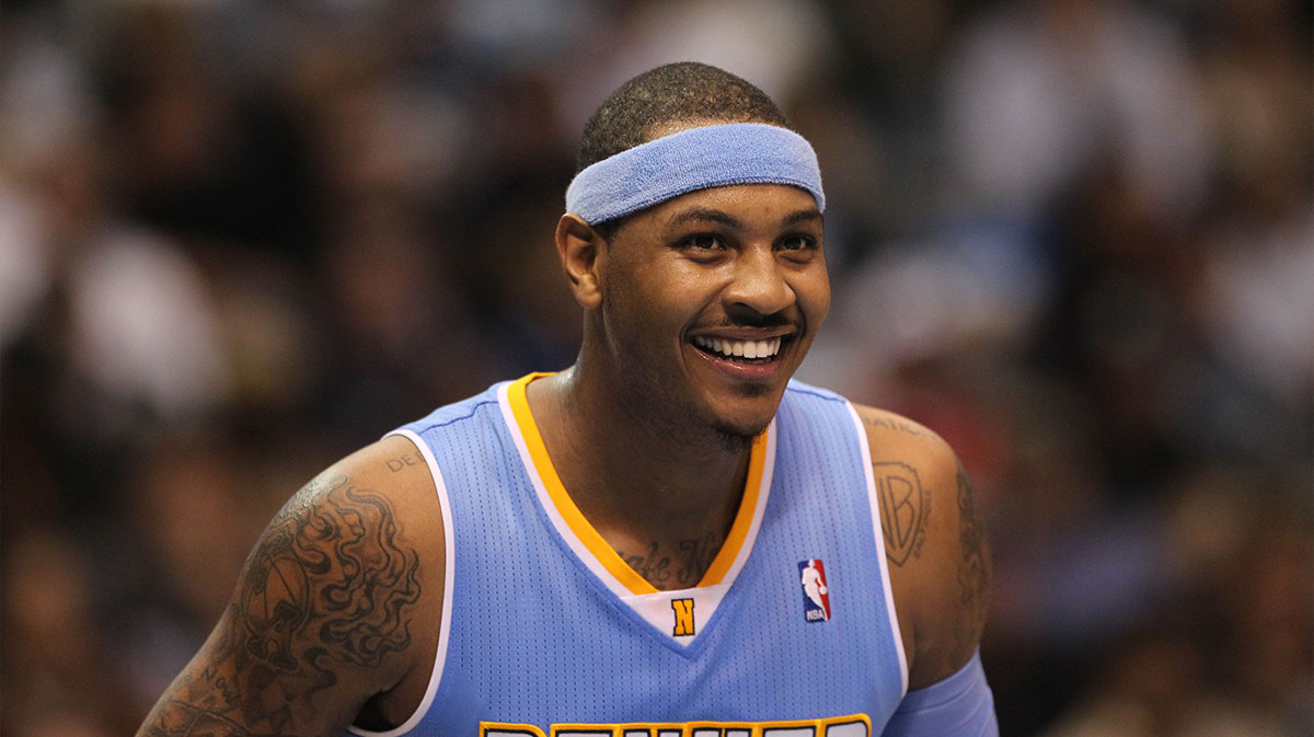 Denver Nuggets forward Carmelo Anthony (15) smiles during a free throw against the Dallas Mavericks at American Airlines Center.