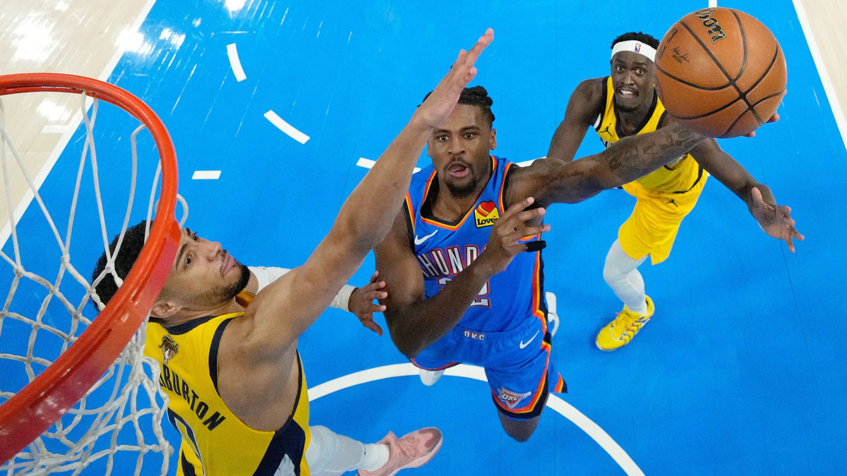 Oklahoma City Thunder guard Cason Wallace (22) shoots against Indiana Pacers guard Tyrese Haliburton (0) during the first half during game two of the 2025 NBA Finals at Paycom Center.