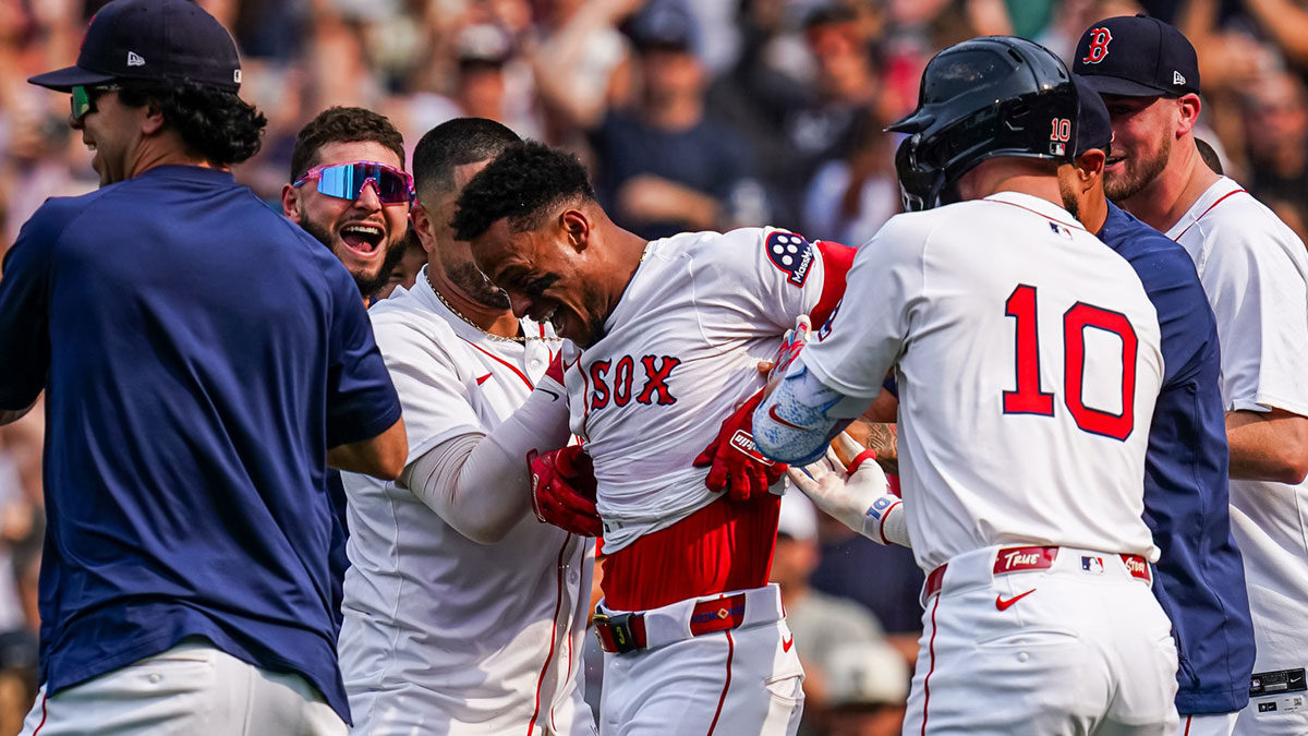 Boston Red Sox outfielder Ceddanne Rafaela (3) is congratulated after hitting a game winning home run against the Los Angeles Angels in the ninth inning at Fenway Park.