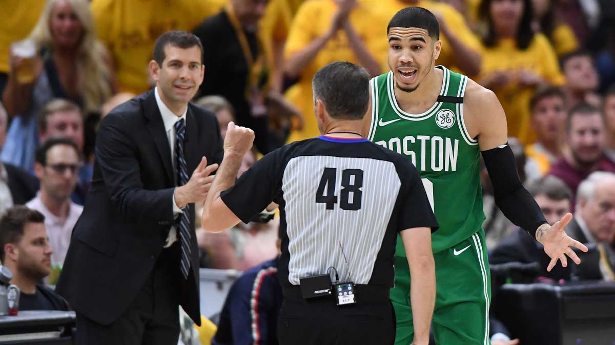 Celtics head coach Brad Stevens and forward Jayson Tatum (0) argue