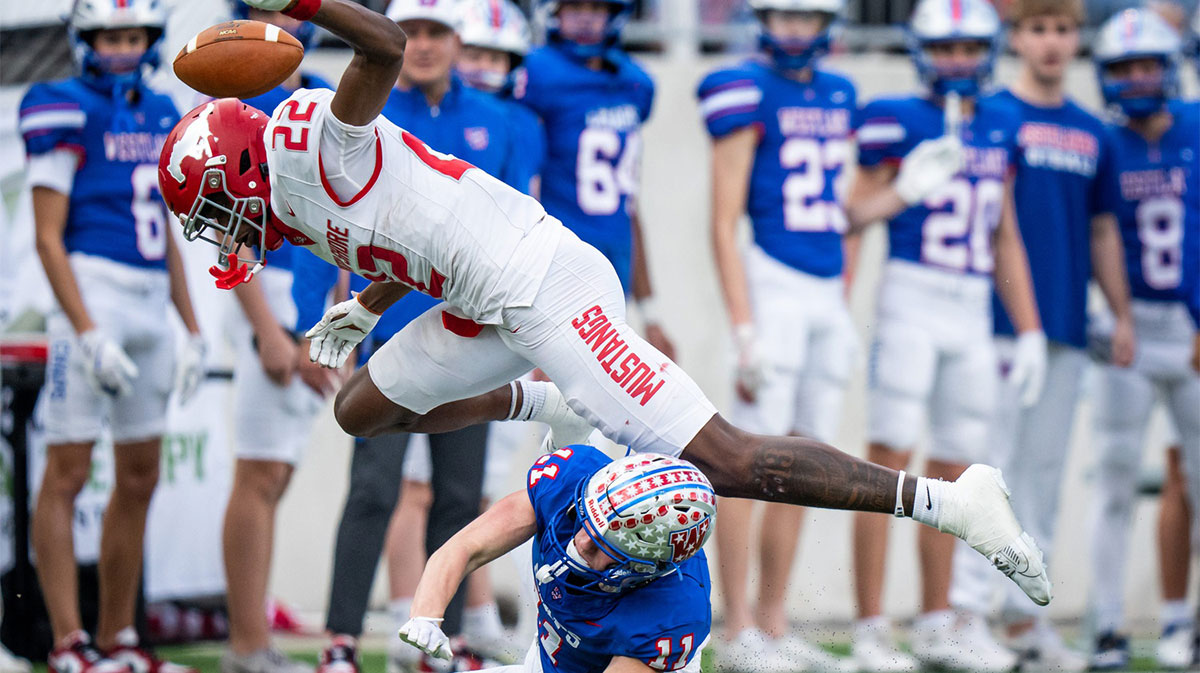 Westlake Chaparrals wide receiver Chase Bowen (11) and North Shore Mustangs free safety Chace Calicut (22) collide after the punt bounces in the first quarter as the Chaparrals take on the Mustangs in the Conference 6A Division 1 UIL State Playoff semi-final game at Legacy Stadium in Katy, Dec. 14, 2024.