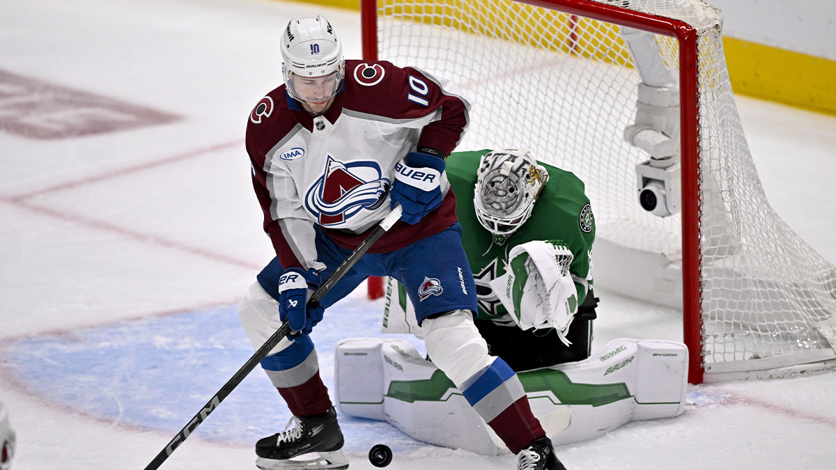 Dallas Stars goaltender Jake Oettinger (29) stops a shot as Colorado Avalanche center Charlie Coyle (10) during the first period looks for the rebound in game seven of the first round of the 2025 Stanley Cup Playoffs at American Airlines Center.