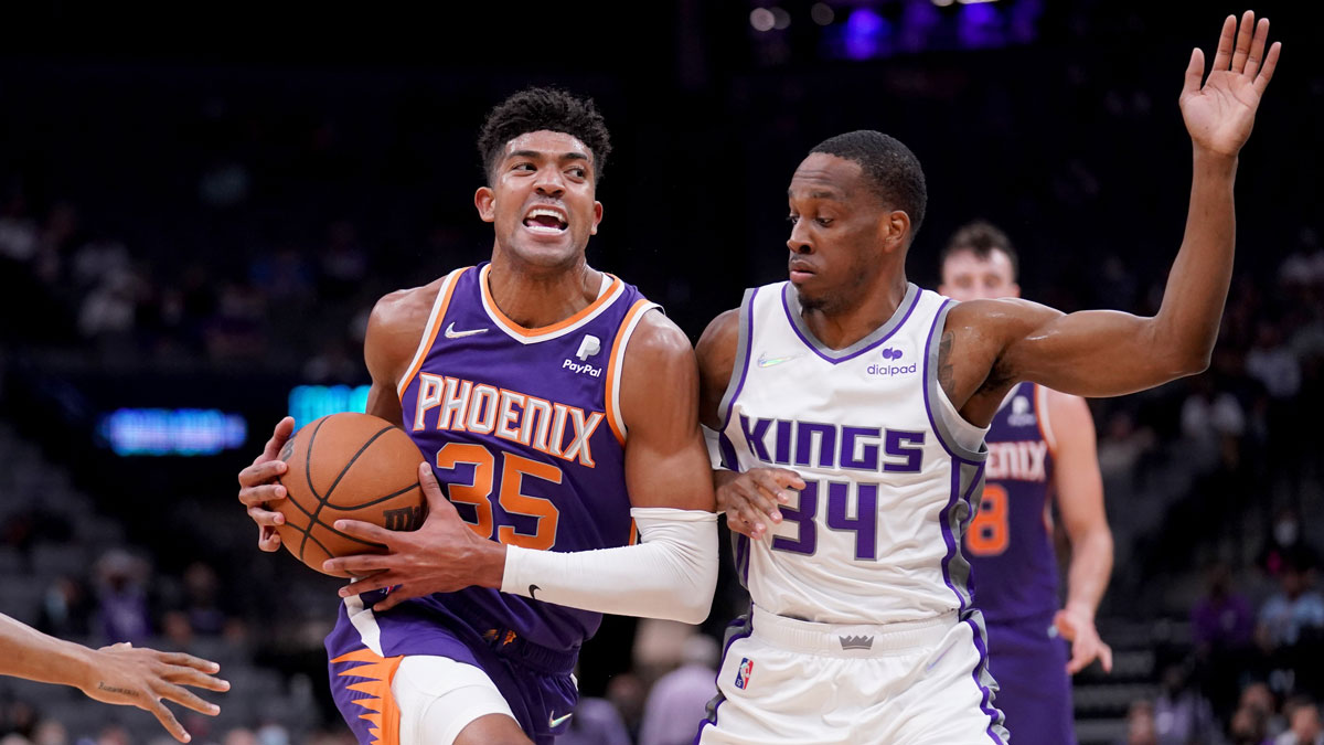 Phoenix Suns forward Chandler Hutchinson (35) is fouled by Sacramento Kings guard Matt Coleman III (34) in the fourth quarter at the Golden 1 Center.