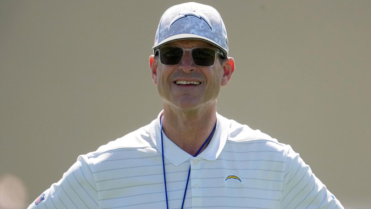 Los Angeles Chargers coach Jim Harbaugh looks on during offseason workouts at The Bolt.