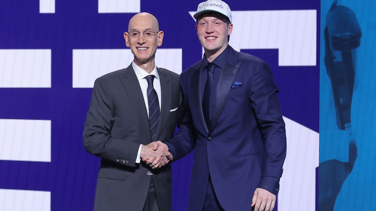 Kon Knueppel stands with NBA commissioner Adam Silver after being selected as the fourth pick by the Charlotte Hornets in the first round of the 2025 NBA Draft at Barclays Center.