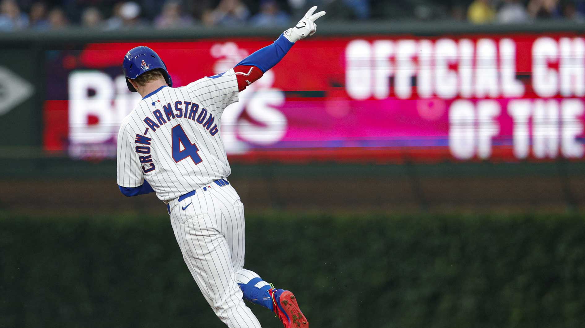 Chicago Cubs center fielder Pete Crow-Armstrong (4) rounds the bases after hitting a two-run home run against the Pittsburgh Pirates during the fourth inning at Wrigley Field.