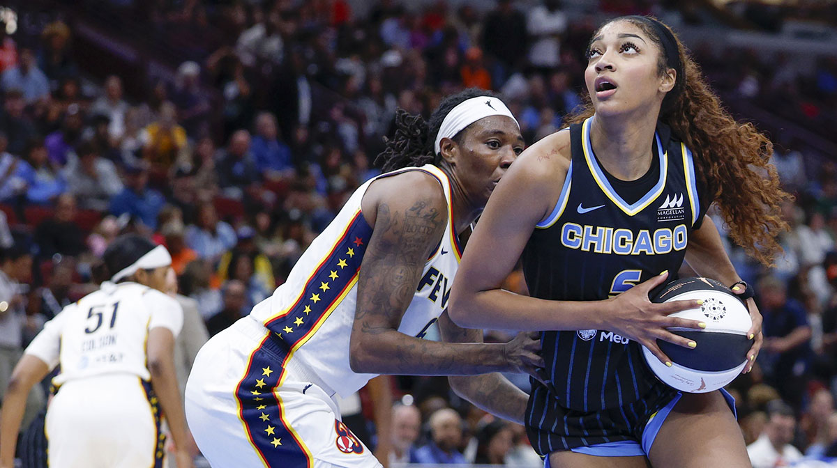 Chicago Sky forward Angel Reese (5) drives to the basket against Indiana Fever forward Natasha Howard (6) during the second half of a WNBA game at United Center.