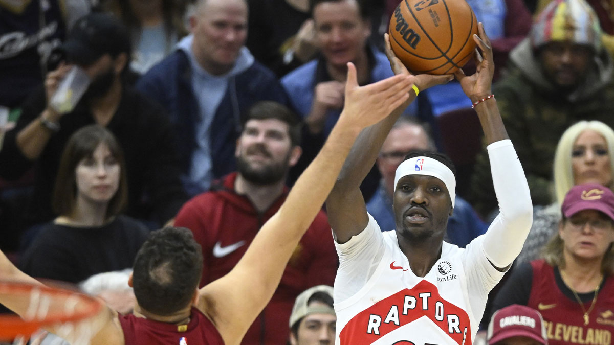 Toronto Raptors forward Chris Boucher (25) shoots beside Cleveland Cavaliers forward Georges Niang (20) in the third quarter at Rocket Mortgage FieldHouse.