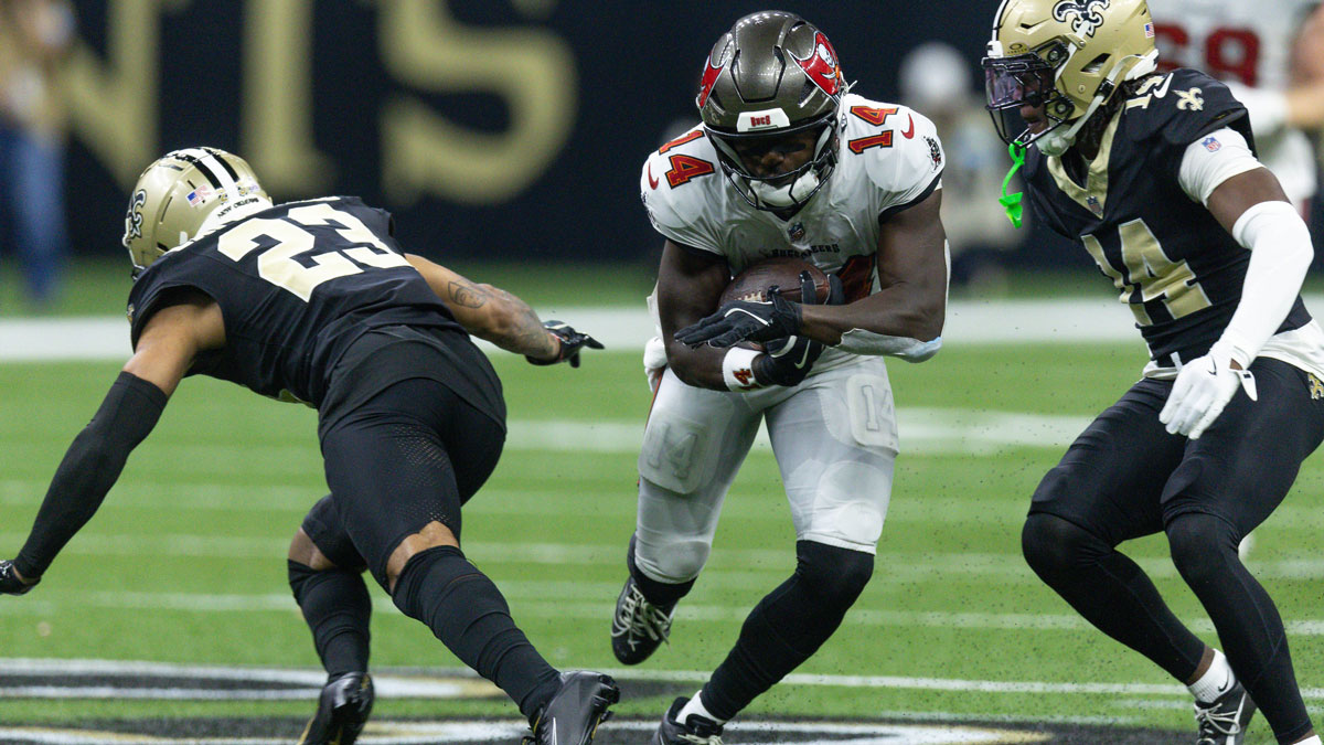 Tampa Bay Buccaneers wide receiver Chris Godwin (14) slips between New Orleans Saints cornerback Marshon Lattimore (23) and New Orleans Saints cornerback Kool-Aid McKinstry (14) during the first half at Caesars Superdome.