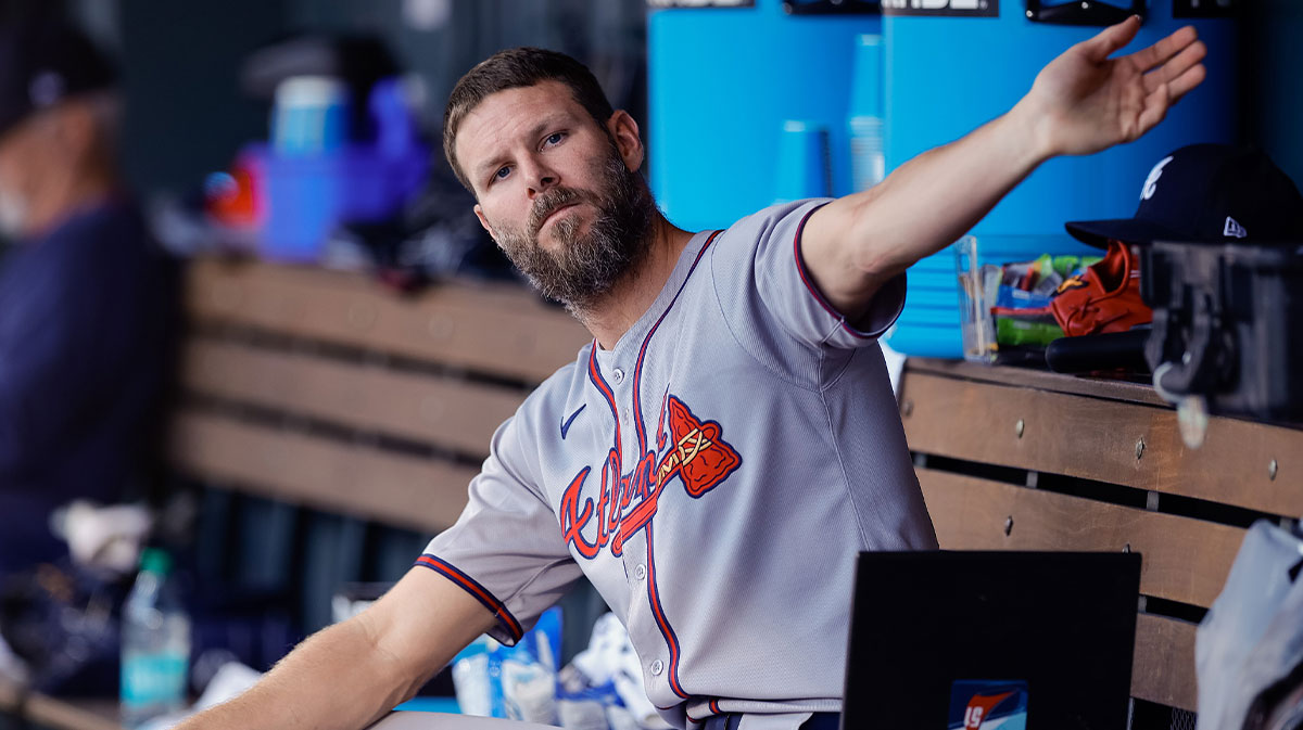 Atlanta Braves starting pitcher Chris Sale (51) stretches in the dugout in the third inning against the Colorado Rockies at Coors Field.
