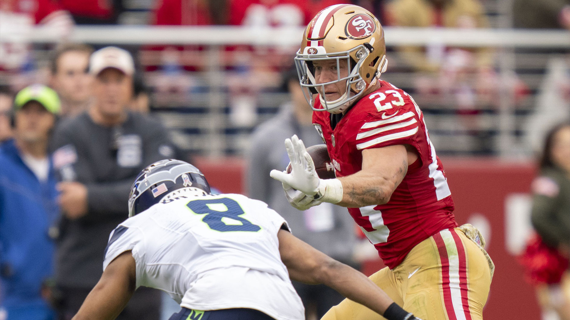 San Francisco 49ers running back Christian McCaffrey (23) runs against Seattle Seahawks cornerback Coby Bryant (8) during the second quarter at Levi's Stadium.