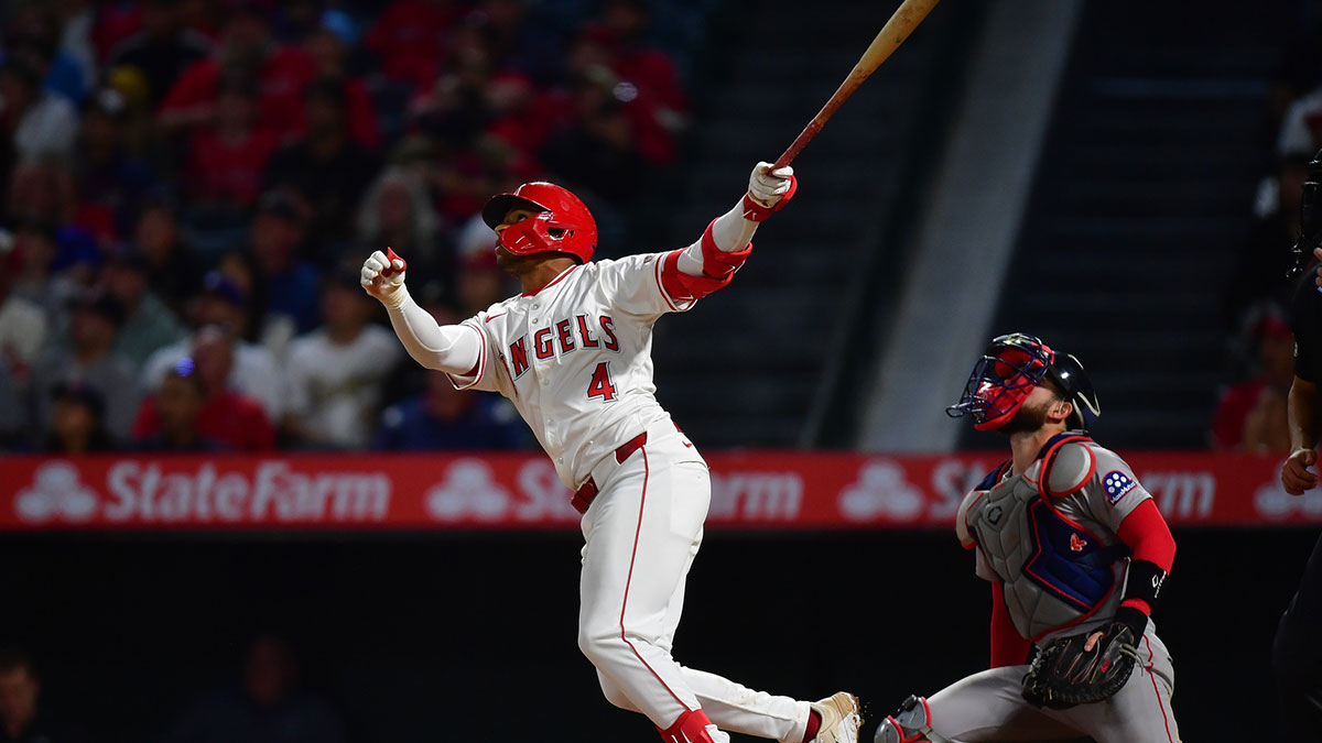Los Angeles Angels second baseman Christian Moore (4) hits a sacrifice RBI against the Boston Red Sox during the eighth inning.