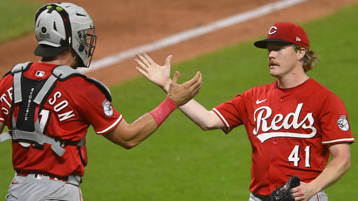 Cincinnati Reds catcher Tyler Stephenson (37) and starting pitcher Andrew Abbott (41) celebrate a win over the Cleveland Guardians at Progressive Field. Reuther