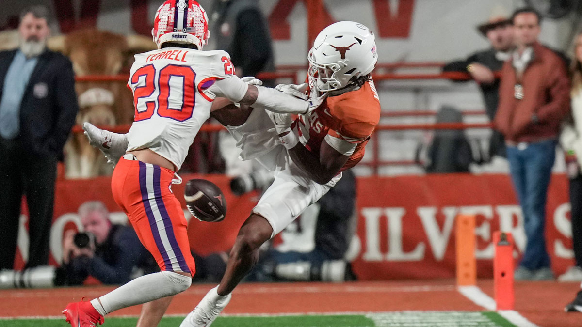 Clemson Tigers cornerback Avieon Terrell (20) is called for pass interference as he tries defend against Texas Longhorns defensive back Malik Muhammad (5) in the second half of an NCAA College Football Playoffs first round game at Darrell K Royal Texas Memorial Stadium, Austin, Texas, Saturday, Dec. 21, 2024.