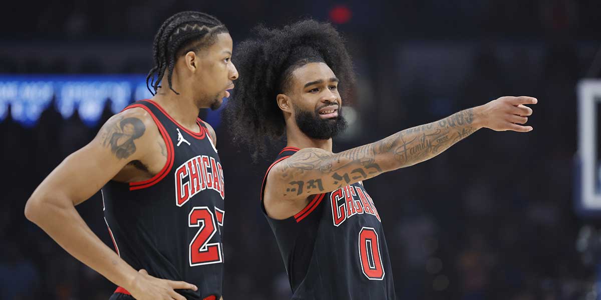 Chicago Bulls guard Coby White (0) talks to forward Dalen Terry (25) during the first quarter against the Oklahoma City Thunder at Paycom Center.