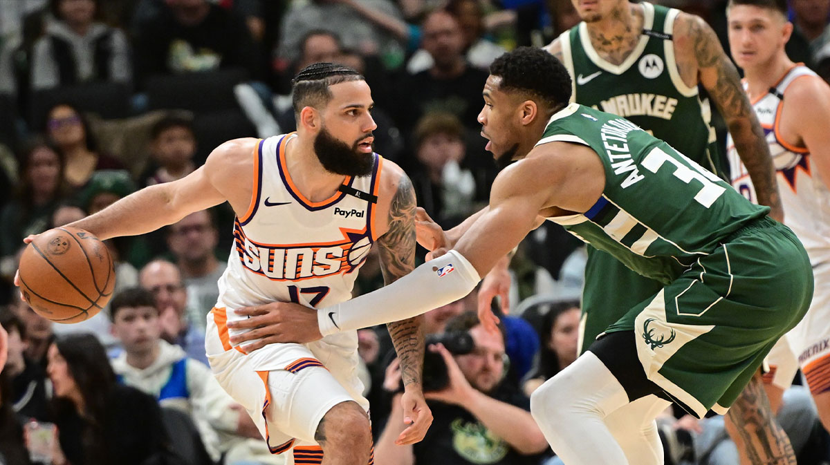Phoenix Suns forward Cody Martin (17) is guarded by Milwaukee Bucks forward Giannis Antetokounmpo (34) in the fourth quarter at Fiserv Forum.