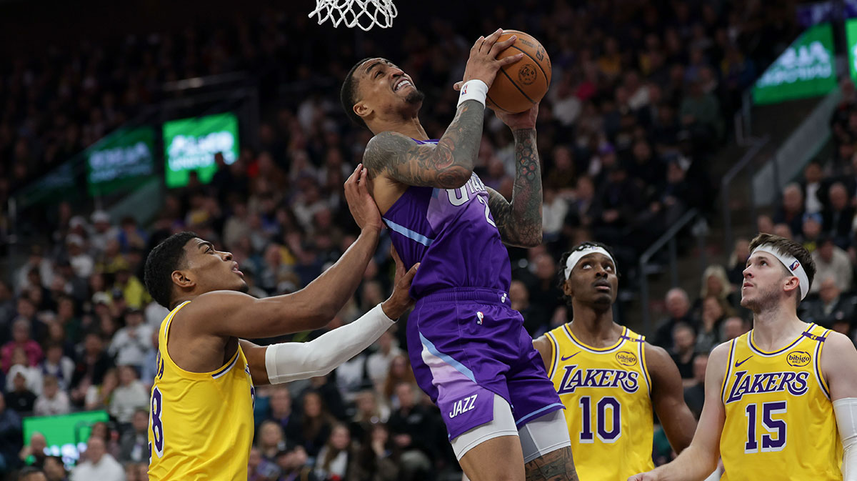 Utah Jazz forward John Collins (20) shoots against Los Angeles Lakers forward Rui Hachimura (28) during the second half at Delta Center.