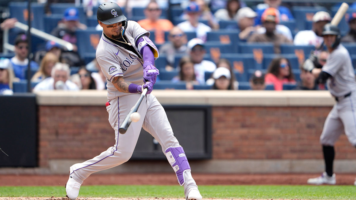Colorado Rockies second baseman Orlando Arcia (8) hits a home run against the New York Mets during the third inning at Citi Field.