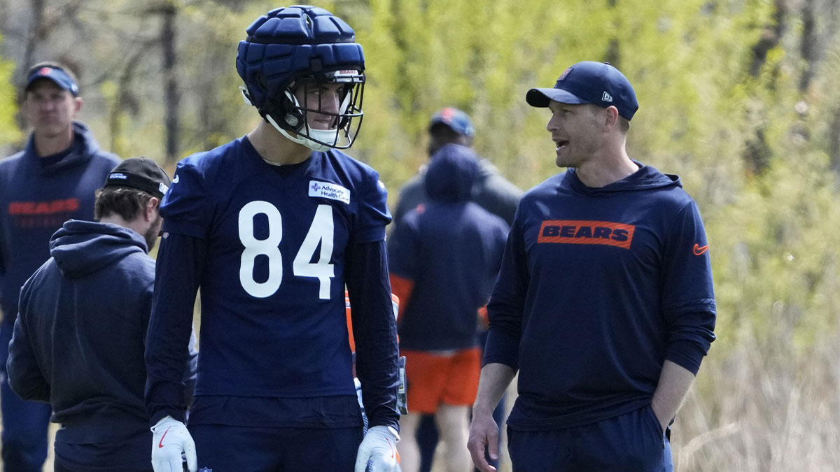 Chicago Bears head coach Ben Johnson talks with tight end (84) Colston Loveland during Rookie Minicamp at Halas Hall.