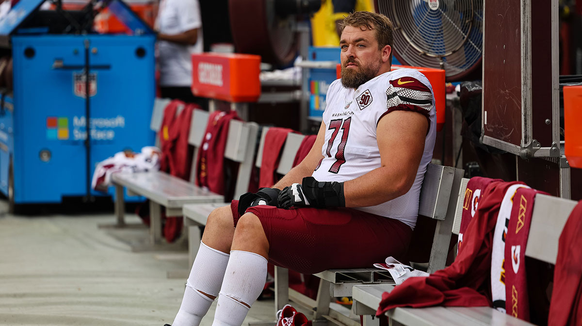 Washington Commanders guard Wes Schweitzer (71) looks on from the sidelines during the second half of the game against the Jacksonville Jaguars at FedExField.
