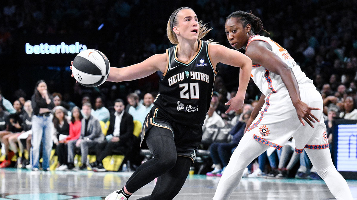 New York Liberty guard Sabrina Ionescu (20) drives past Connecticut Sun center Tina Charles (31) during the second half at Barclays Center.