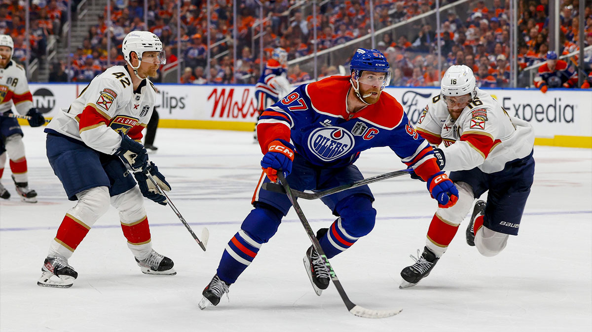 Edmonton Oilers center Connor McDavid (97) controls the puck against Florida Panthers forward Aleksander Barkov (16) during the third period in game five of the 2025 Stanley Cup Final at Rogers Place.
