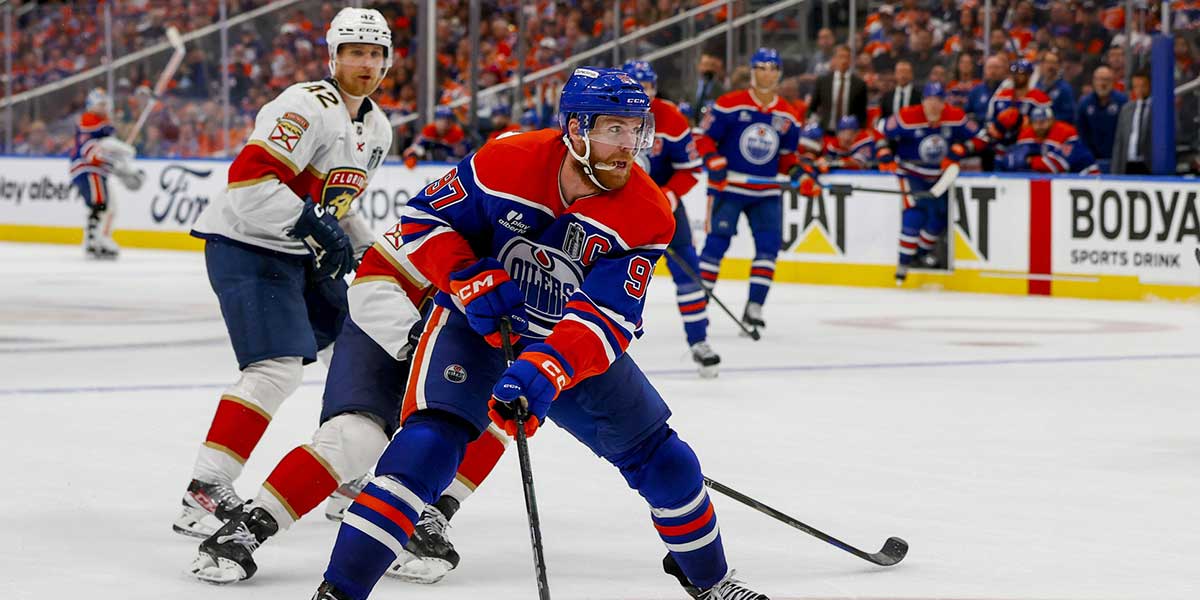 Edmonton Oilers center Connor McDavid (97) controls the puck against Florida Panthers forward Aleksander Barkov (16) during the third period in game five of the 2025 Stanley Cup Final at Rogers Place.