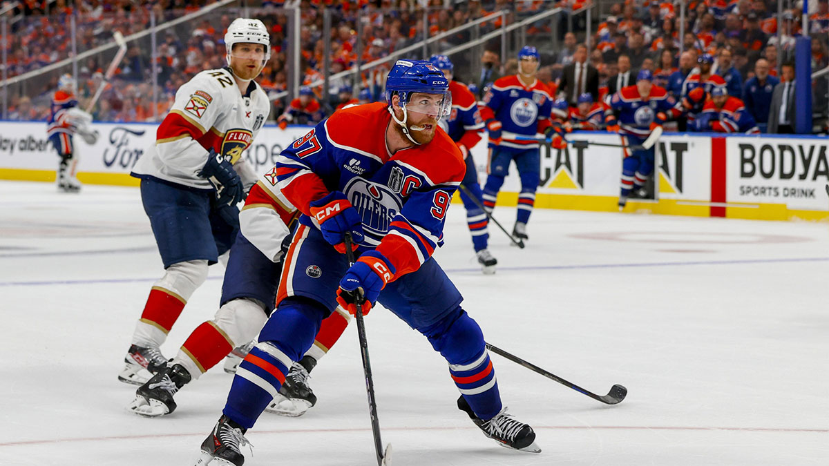 Edmonton Oilers center Connor McDavid (97) controls the puck against Florida Panthers forward Aleksander Barkov (16) during the third period in game five of the 2025 Stanley Cup Final at Rogers Place.