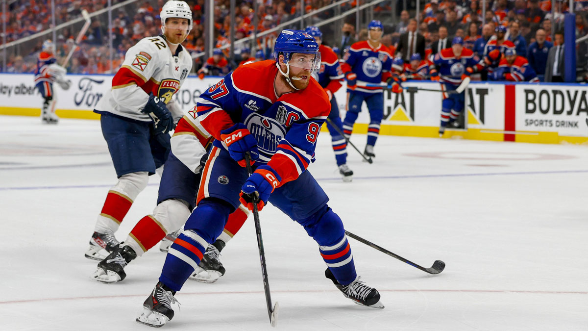 Edmonton Oilers center Connor McDavid (97) controls the puck against Florida Panthers forward Aleksander Barkov (16) during the third period in game five of the 2025 Stanley Cup Final at Rogers Place.