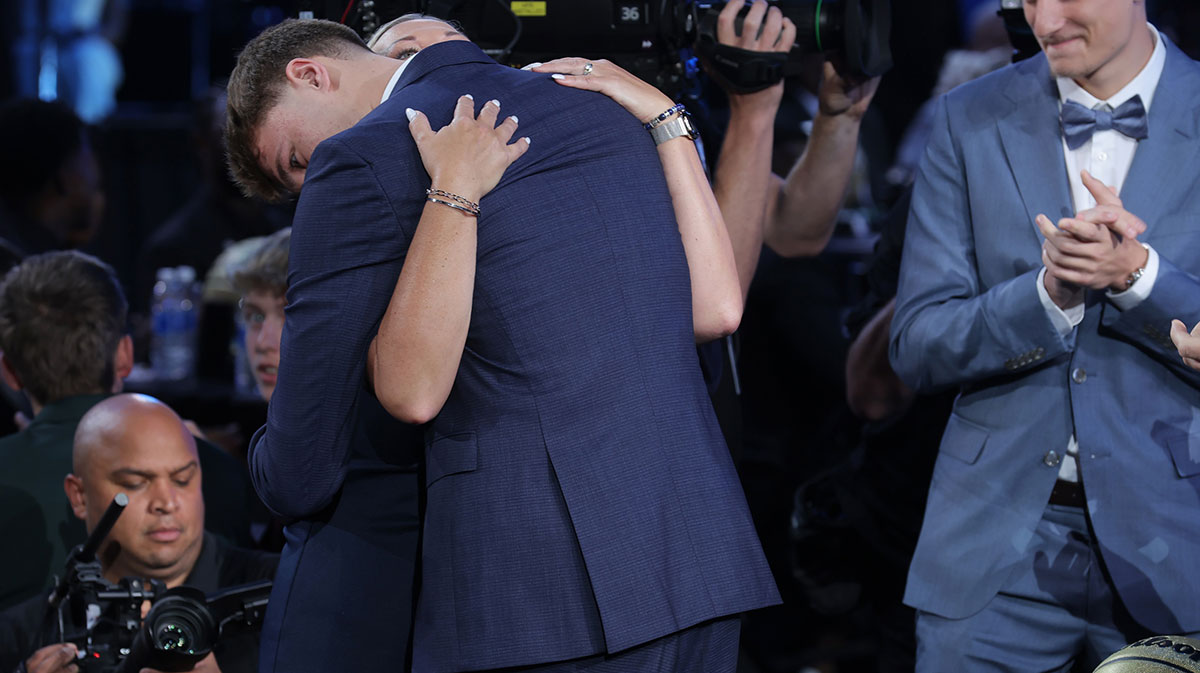 Cooper Flagg embraces his mom Kelly Flagg after being selected as first overall by the Dallas Mavericks in the first round of the 2025 NBA Draft at Barclays Center.