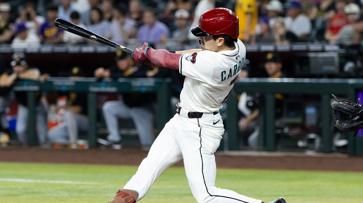 May 27, 2025; Phoenix, Arizona, USA; Arizona Diamondbacks outfielder Corbin Carroll hits a solo home run in the first inning against the Pittsburgh Pirates at Chase Field.