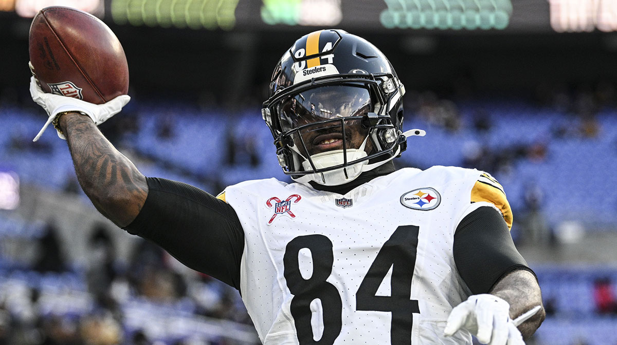 Pittsburgh Steelers running back Cordarrelle Patterson (84) throws the ball to fans before the game against the Baltimore Ravens at M&T Bank Stadium.