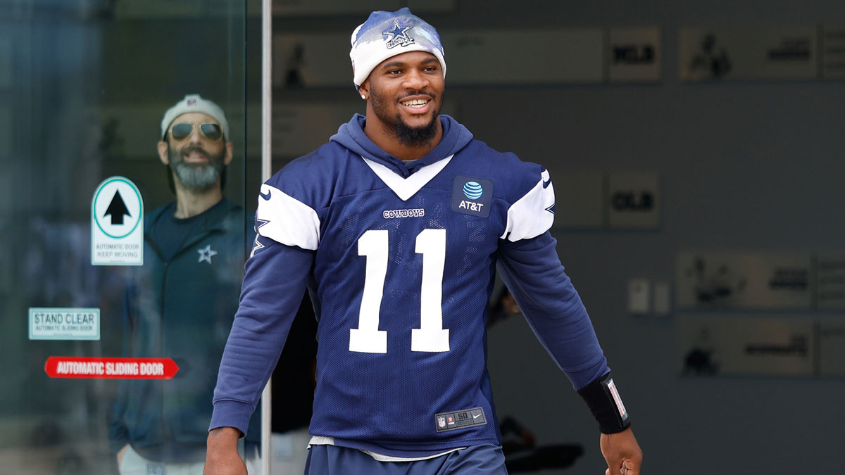 Dallas Cowboys defensive end Micah Parsons (11) walks onto the practice field at the Ford Center at the Star Training Facility in Frisco, Texas.