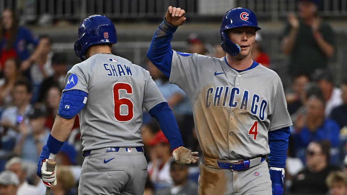 Chicago Cubs center fielder Pete Crow-Armstrong (4) is congratulated by third baseman Matt Shaw (6) after scoring against the Washington Nationals during the fifth inning at Nationals Park.
