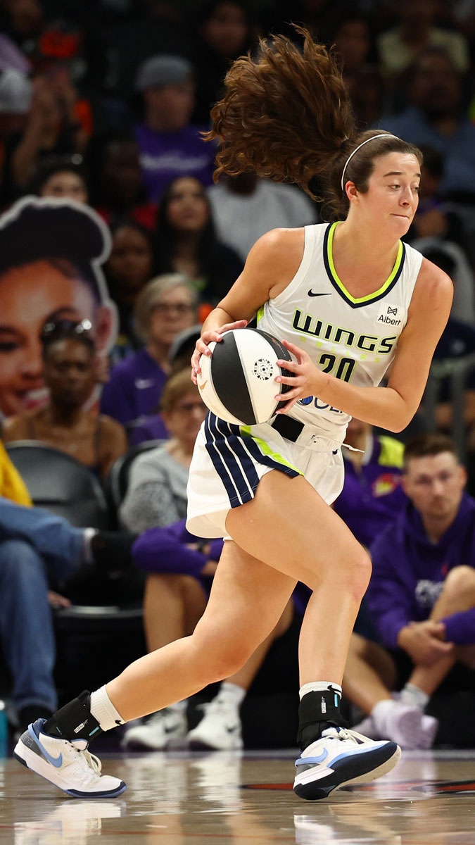 Jun 11, 2025; Phoenix, Arizona, USA; Dallas Wings forward Maddy Siegrist (20) against the Phoenix Mercury at PHX Arena. Mandatory Credit: Mark J. Rebilas-Imagn Images