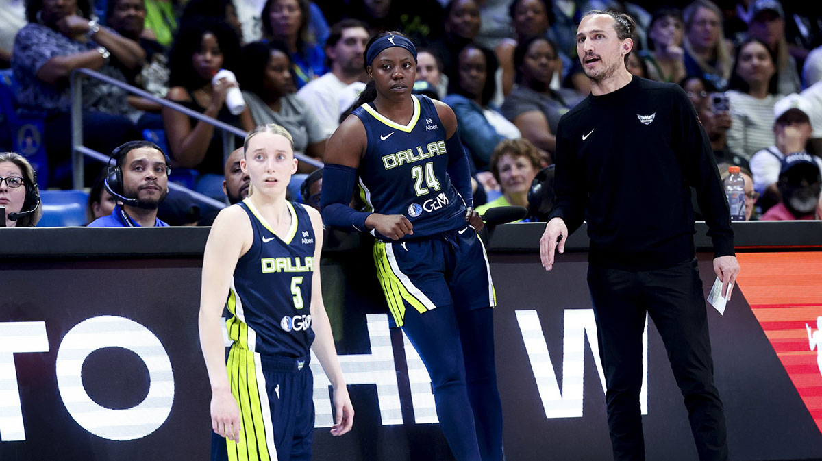 Dallas Wings guard Paige Bueckers (5) and Dallas Wings guard Arike Ogunbowale (24) and Dallas Wings head coach Chris Koclanes talk against the Minnesota Lynx during the first half at College Park Center.
