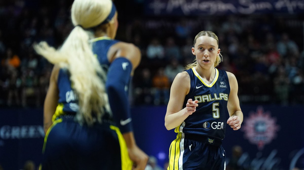 Dallas Wings guard Paige Bueckers (5) reacts with guard DiJonai Carrington (21) after a play against the Connecticut Sun in the first half.