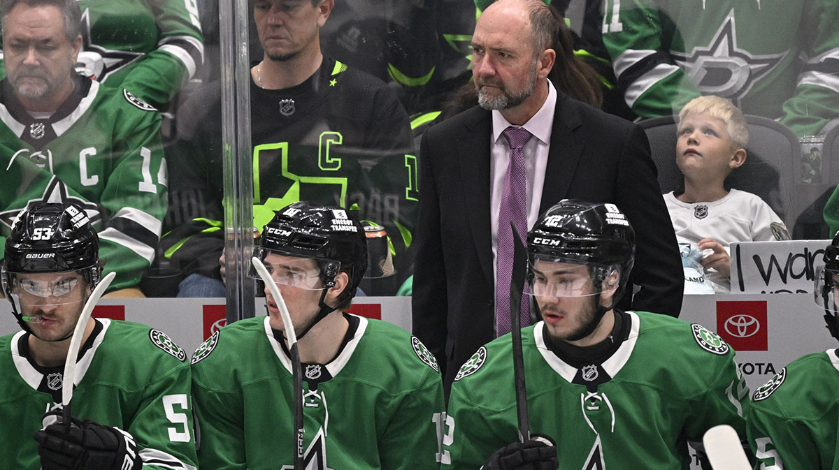Dallas Stars head coach Pete DeBoer looks on from the team bench during the first period against the Utah Hockey Club at the American Airlines Center.