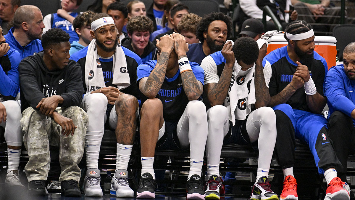 The Dallas Mavericks team bench reacts to a Denver Nuggets score during the second half at the American Airlines Center.