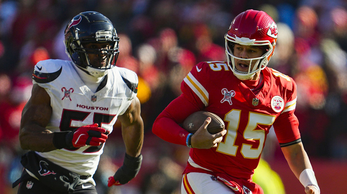 Kansas City Chiefs quarterback Patrick Mahomes (15) runs the ball against Houston Texans defensive end Danielle Hunter (55) during the first half at GEHA Field at Arrowhead Stadium.