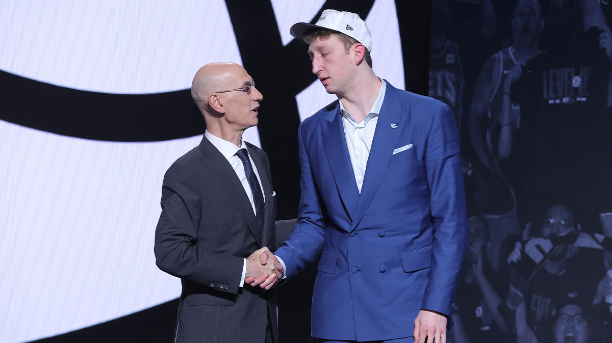 Danny Wolf stands with NBA commissioner Adam Silver after being selected as the 27th pick by the Brooklyn Nets in the first round of the 2025 NBA Draft at Barclays Center.