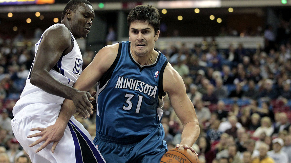 Minnesota Timberwolves center Darko Milicic (31) drives past Sacramento Kings center Samuel Dalembert (10) in the first quarter at Arco Arena.