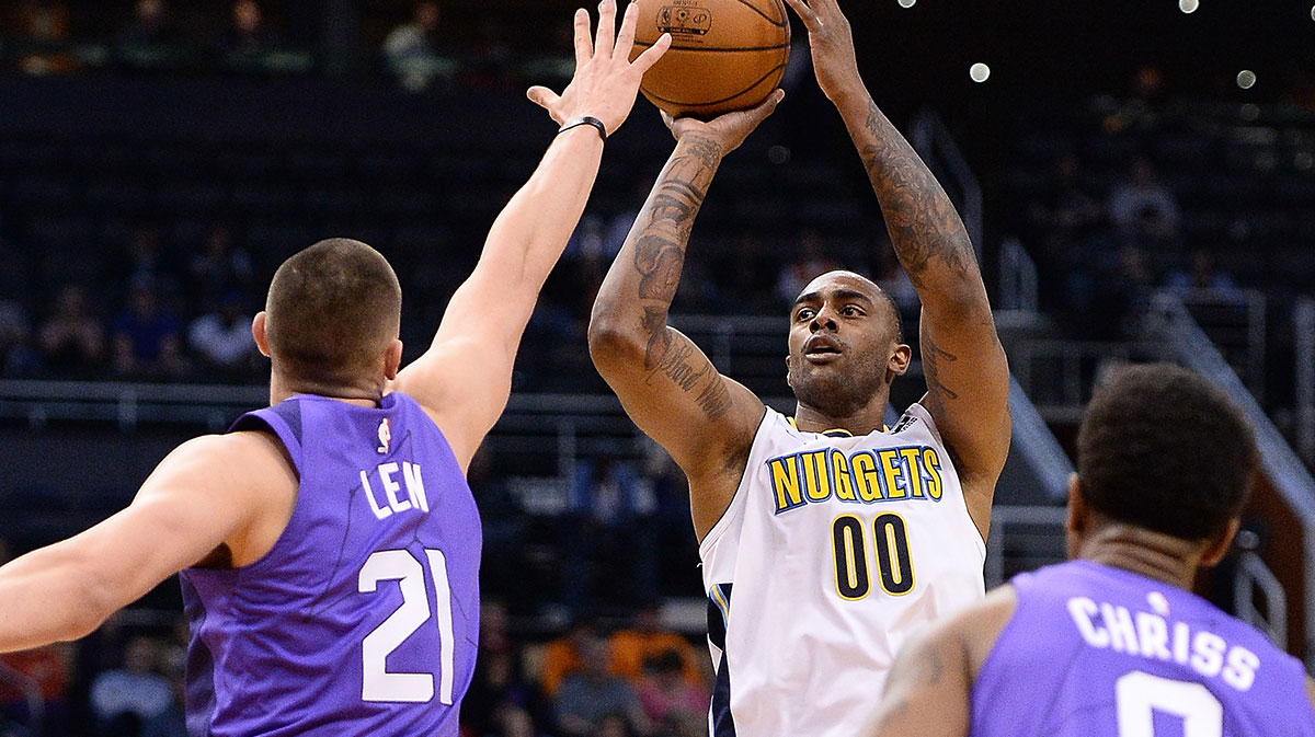 Denver Nuggets forward Darrell Arthur (00) shoots the ball over Phoenix Suns center Alex Len (21) in the first half at Talking Stick Resort Arena.