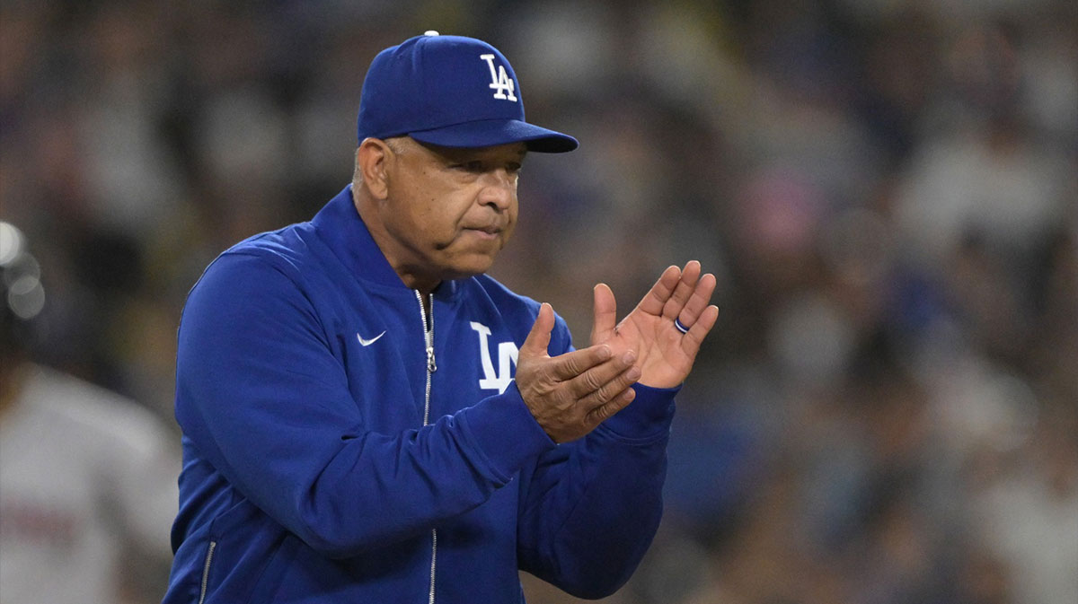 Los Angeles Dodgers manager Dave Roberts (30) walks to the mound for a pitching change in the eighth inning against the Arizona Diamondbacks at Dodger Stadium.