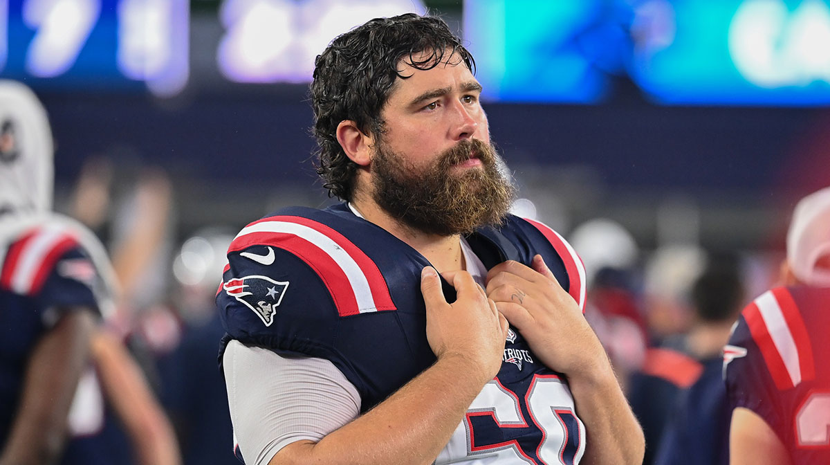 New England Patriots center David Andrews (60) watches from the sideline during the first half against the Carolina Panthers at Gillette Stadium.