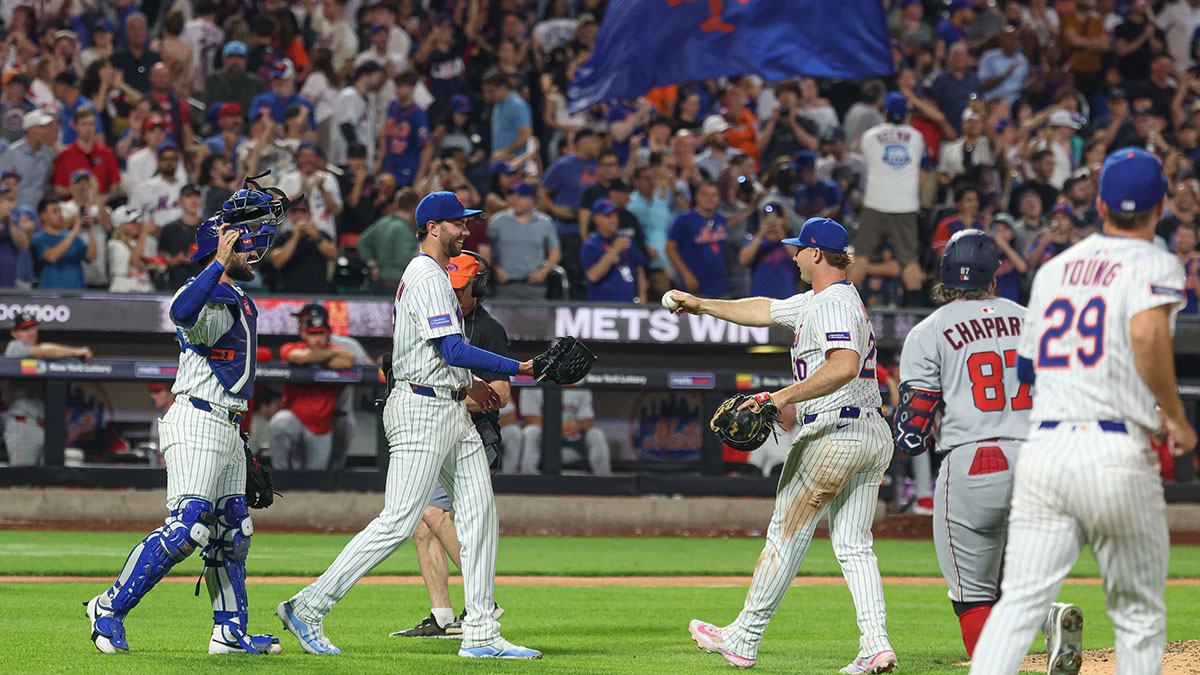 Jun 11, 2025; New York City, New York, USA; New York Mets starting pitcher David Peterson (23) celebrates with teammates after defeating the Washington Nationals at Citi Field.